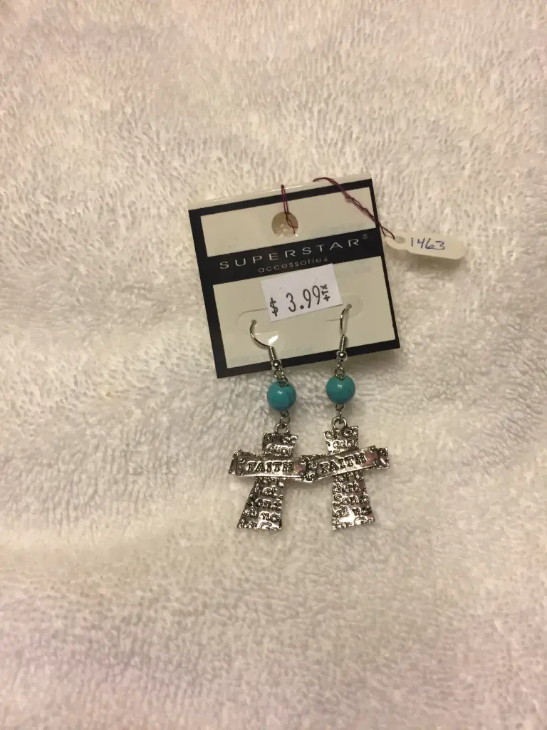 Burnished metal 'Faith' cross dangling earring. Color silver/turquoise